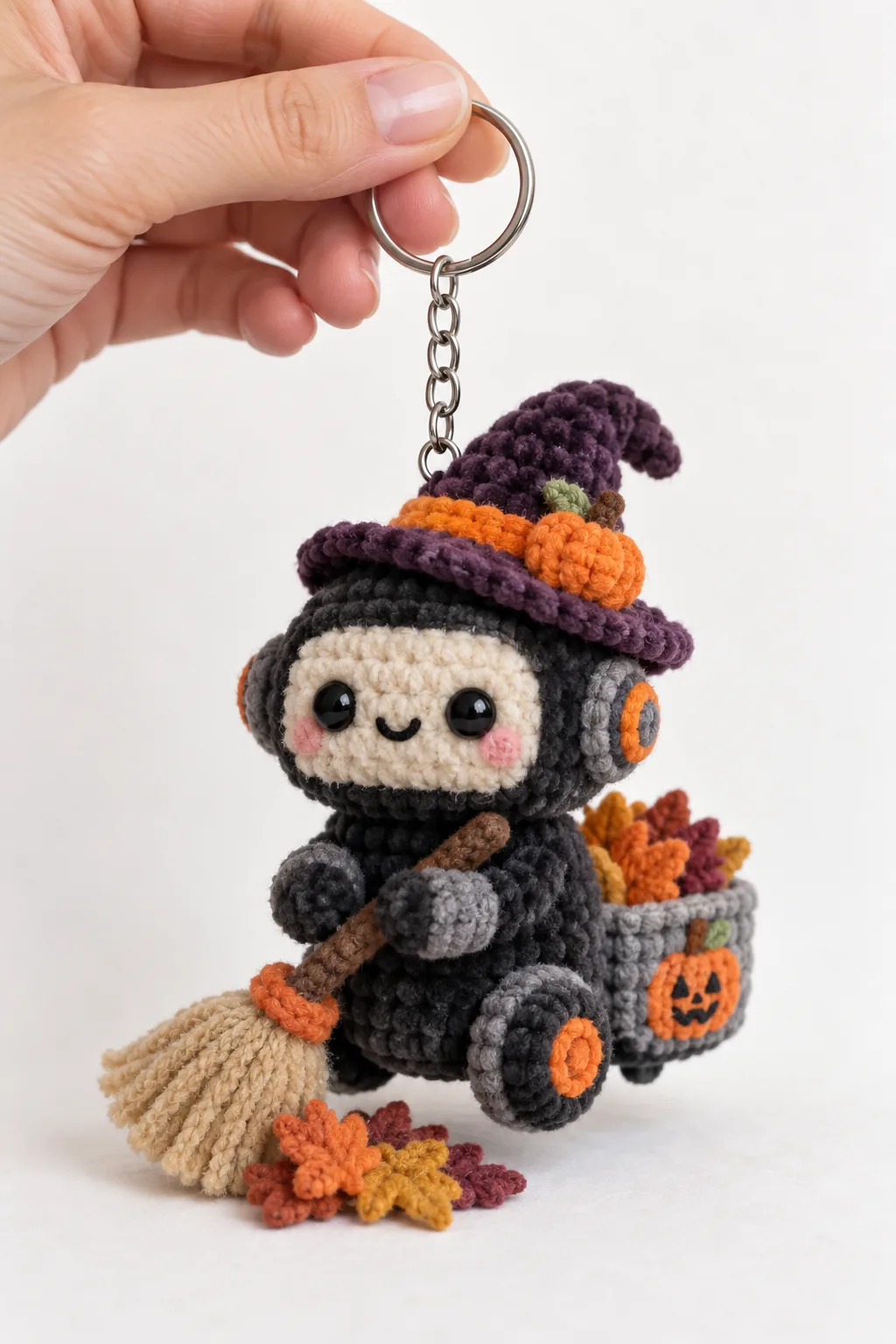 Little witch driving a fall harvest tractor crochet keychain