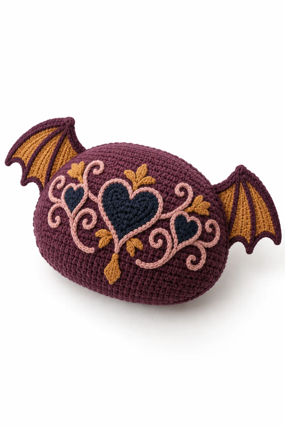 Aubergine crochet oval cushion with bat wings in woven heart scrolls stitch