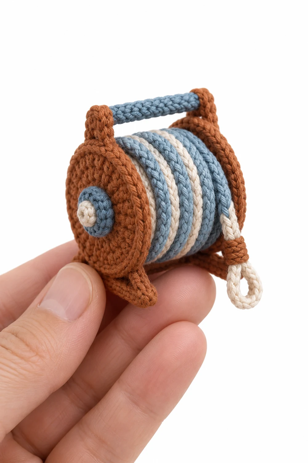 Cinnamon miniature crochet rescue rope coiled on a round reel