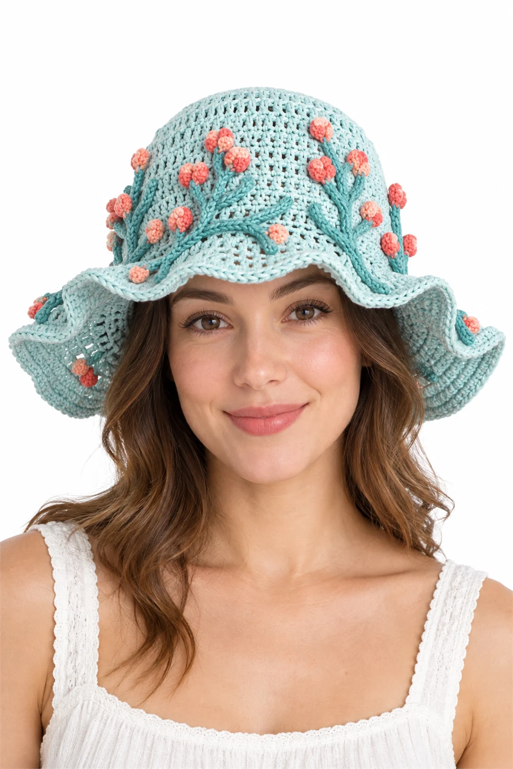 Coral pink crochet sun hat with wide ruffled brim and lichen texture