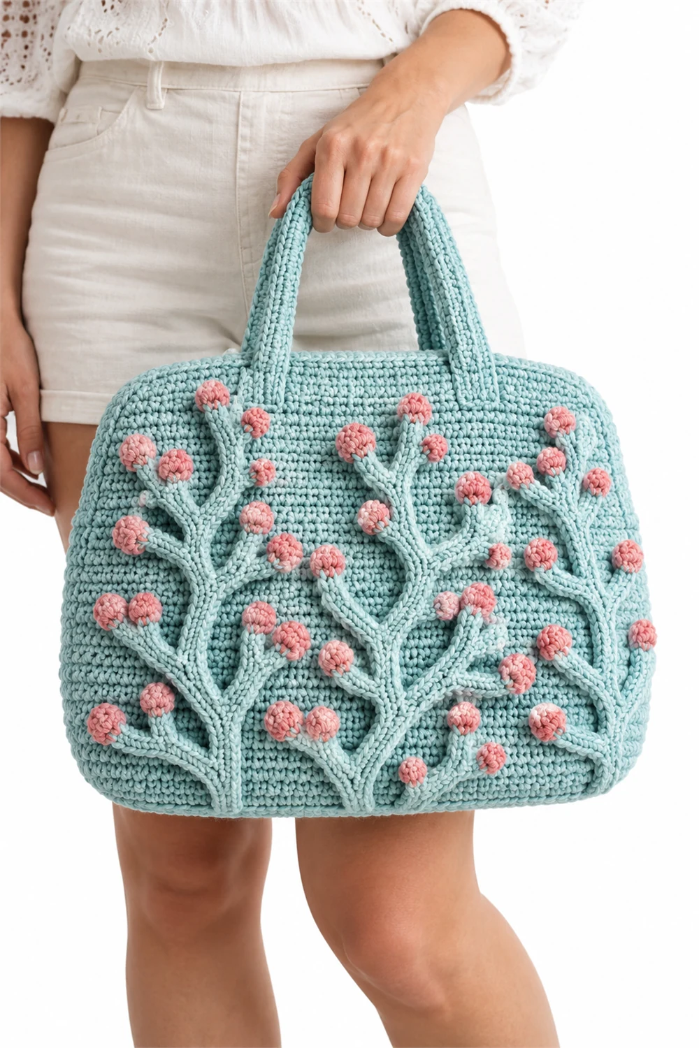 Coral lichen textured crochet bowler tote bag in vertical silhouette