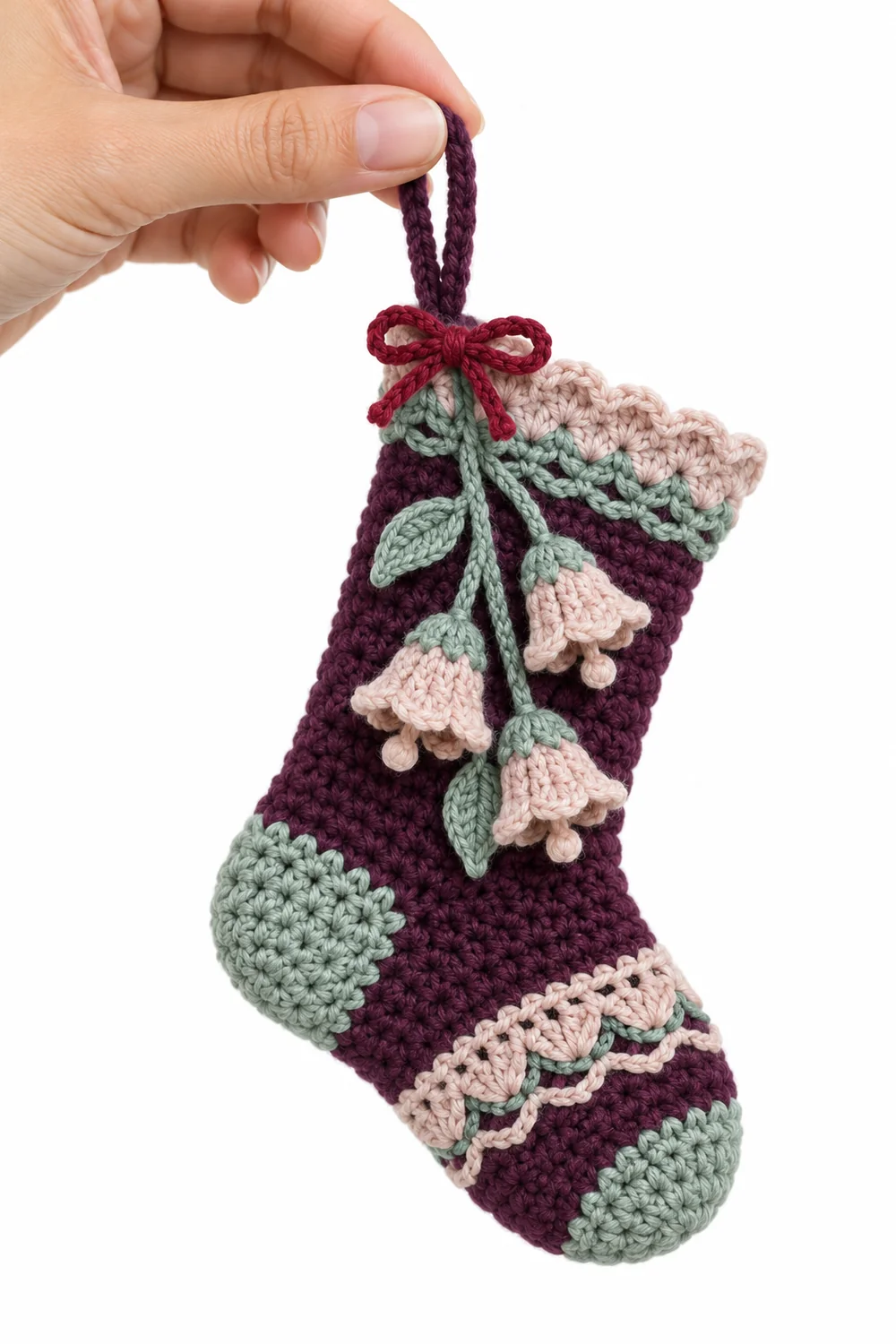 Deep plum crochet small Christmas stocking ornament in alpine bellflower lace