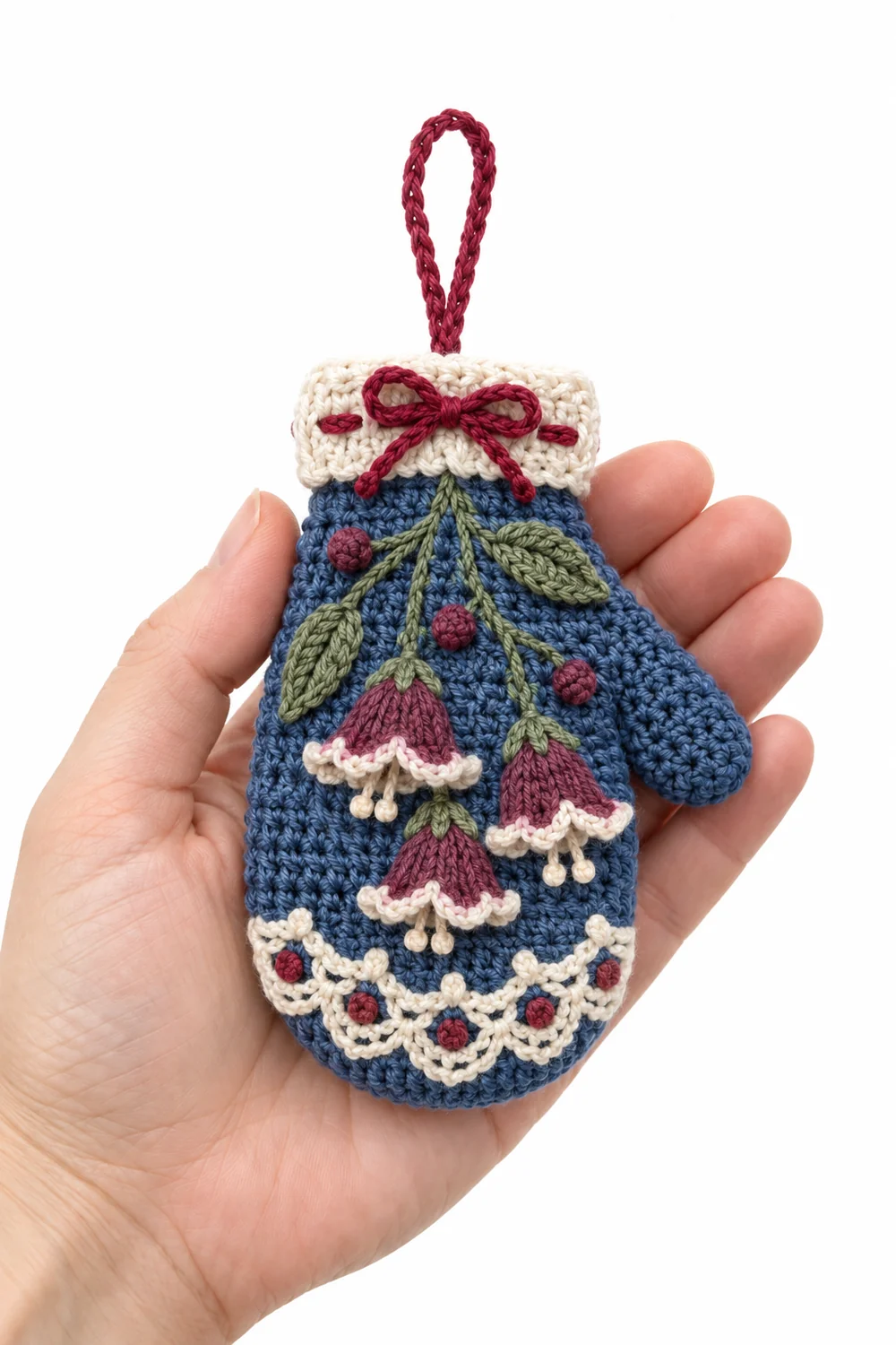 Denim blue crochet mitten-shaped Christmas ornament in alpine bellflower lace