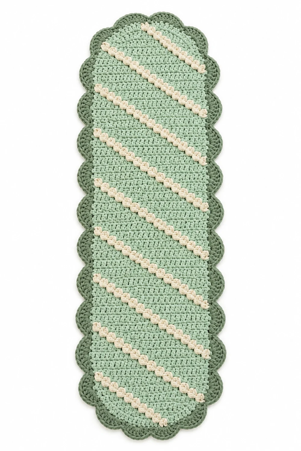 Mint green oblong crochet rug with scalloped wavy edges