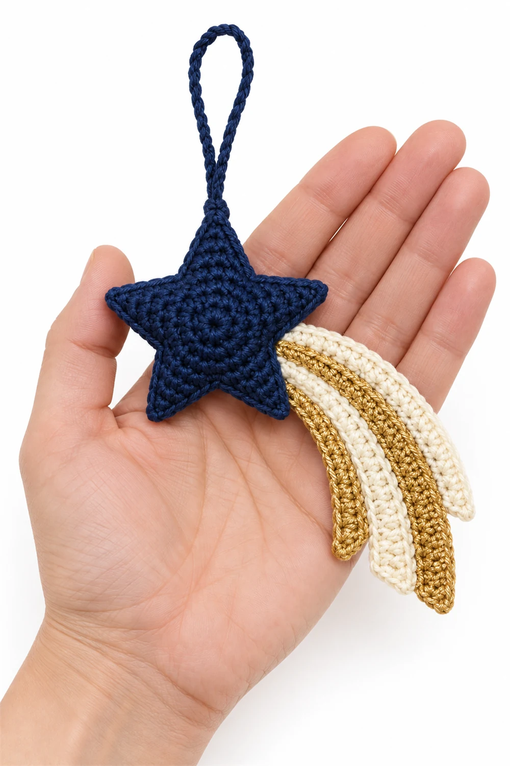 Navy blue crochet comet ornament with long streaming tail