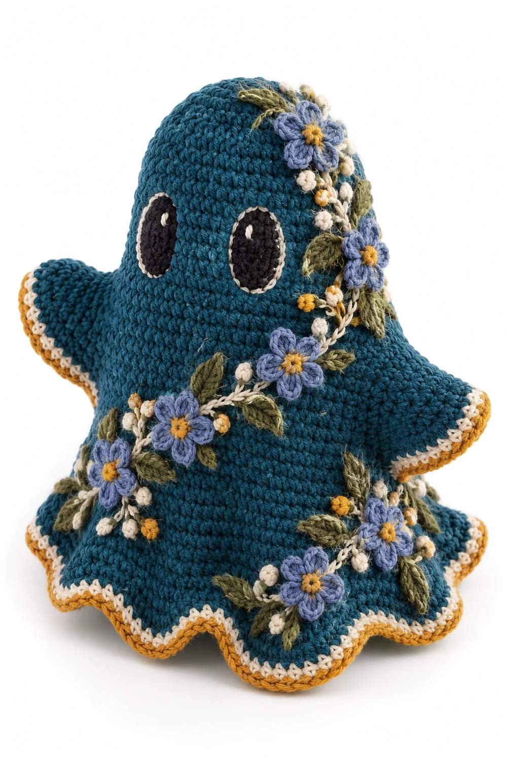 Petrol blue crochet ghost-shaped cushion with smiling face and stars