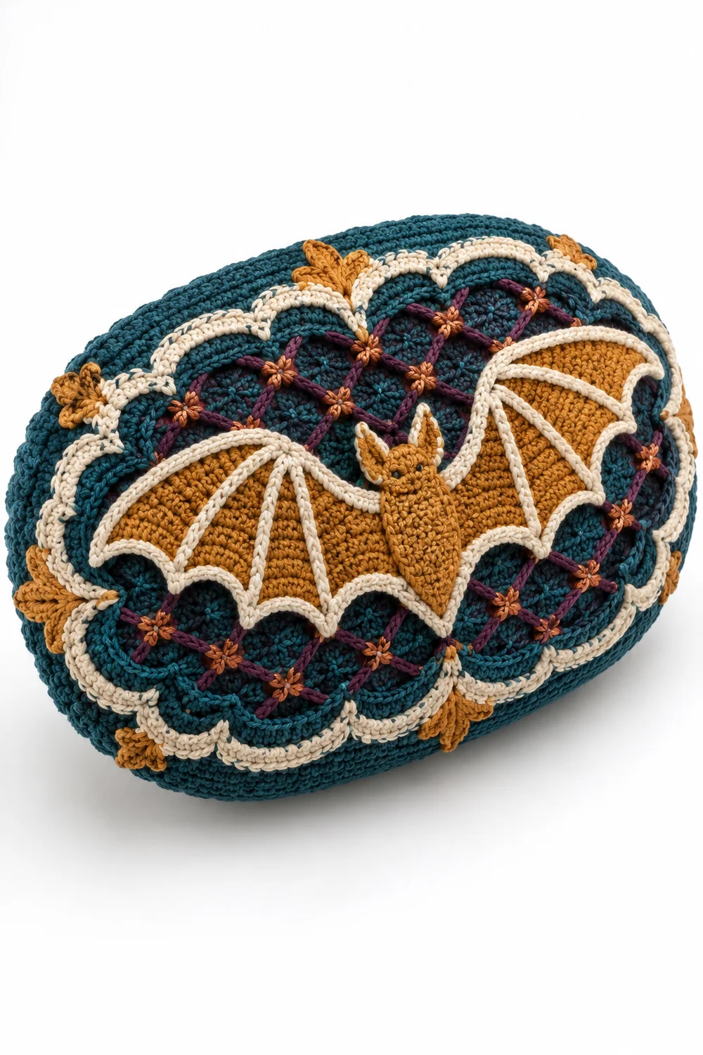 Petrol teal crochet oval cushion shaped like bat wings with honey amber accents
