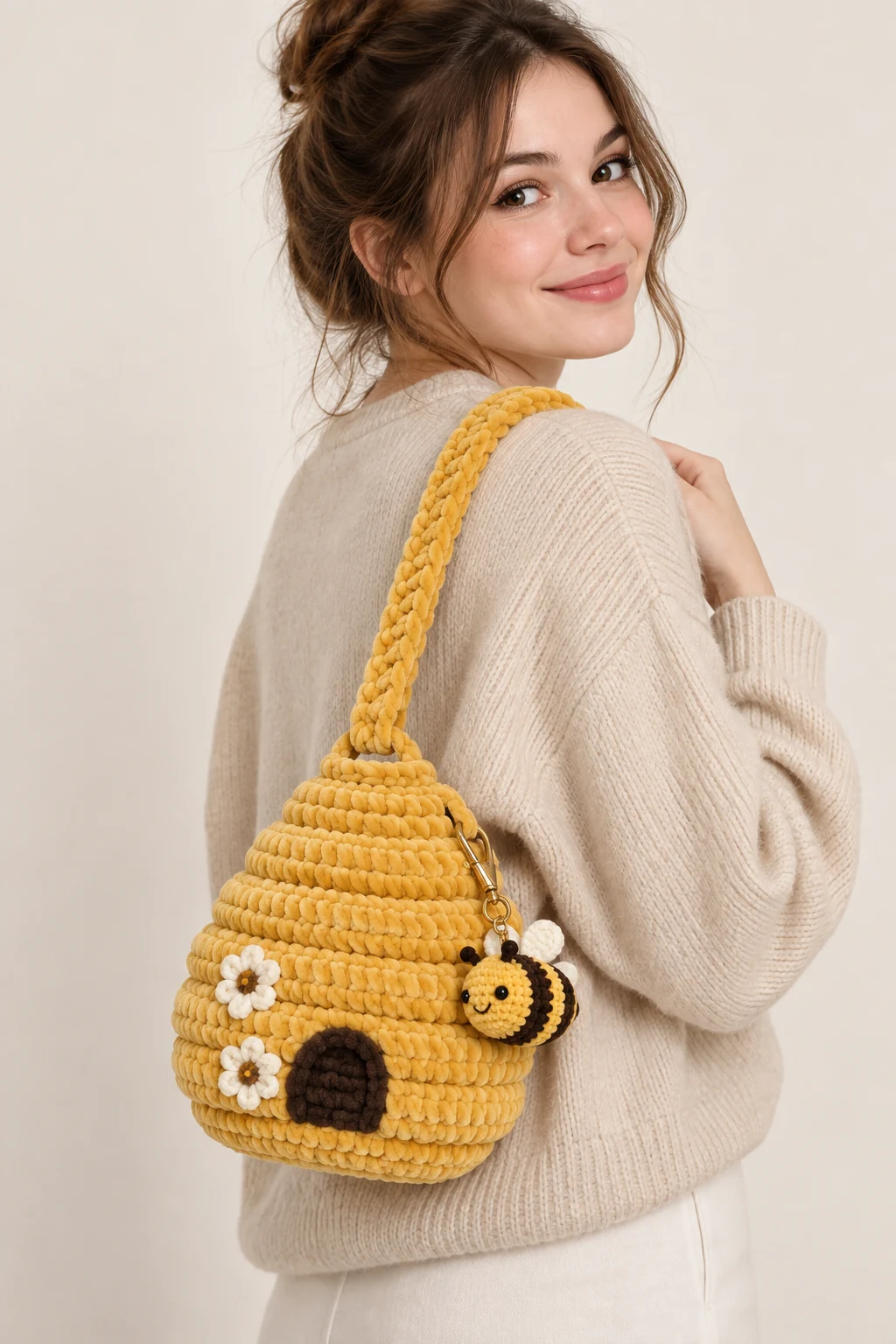 Golden crochet beehive-shaped shoulder bag with bee details
