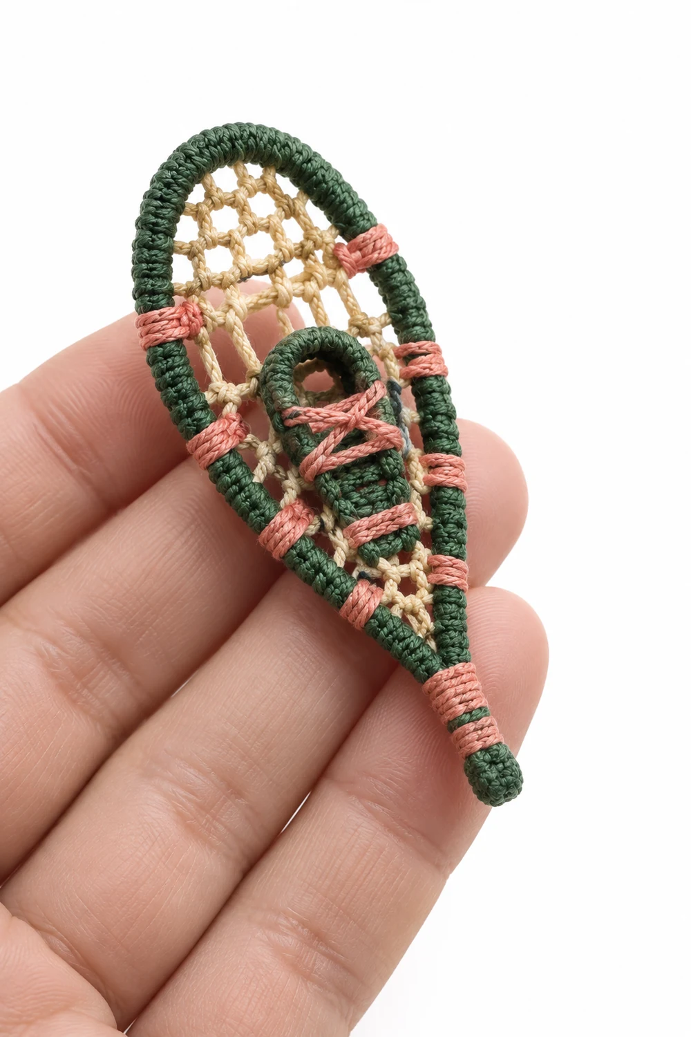 Pine green miniature crochet snowshoe with oval openwork webbing