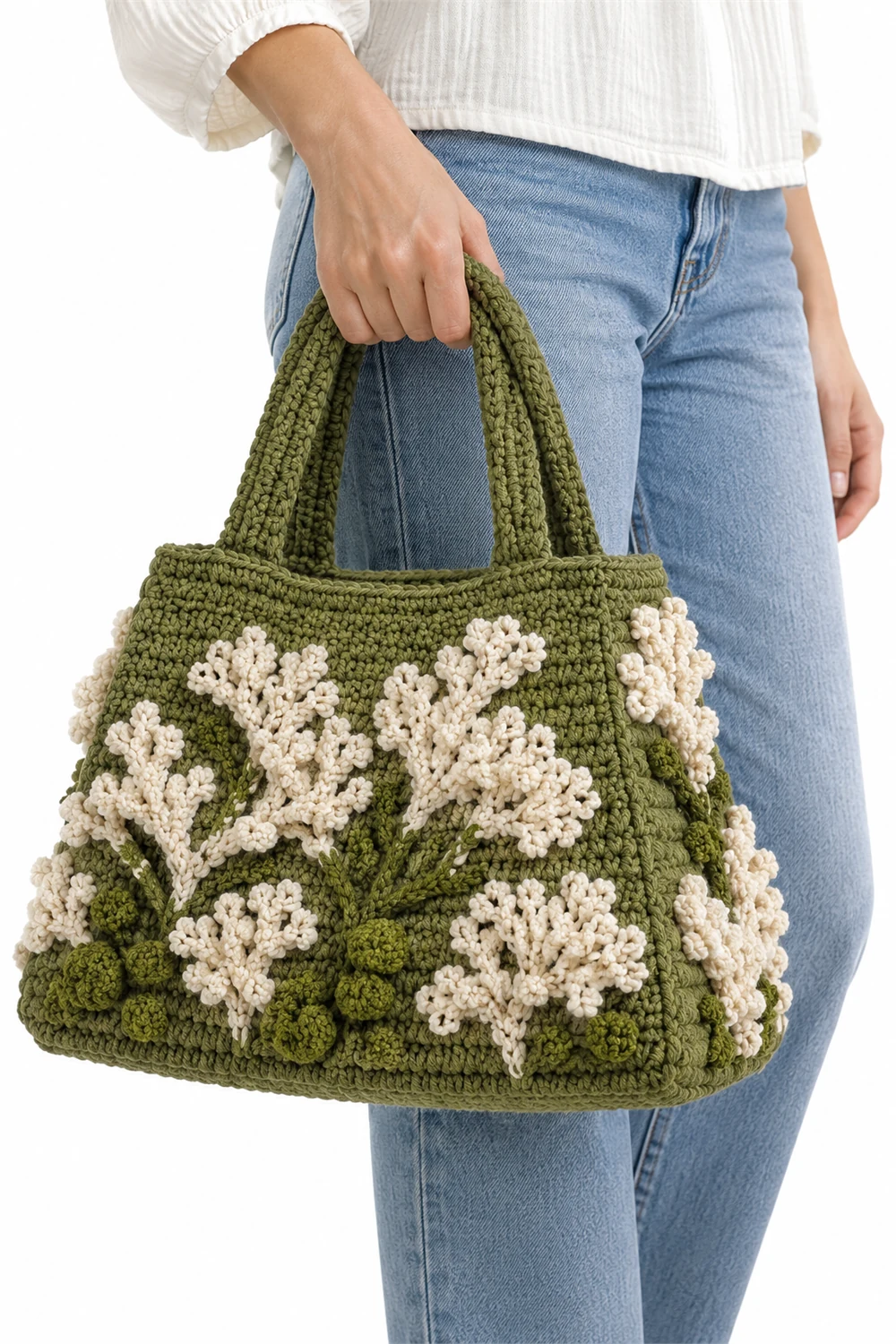 Pale green crochet trapezoid bag with top handle and reindeer lichen texture