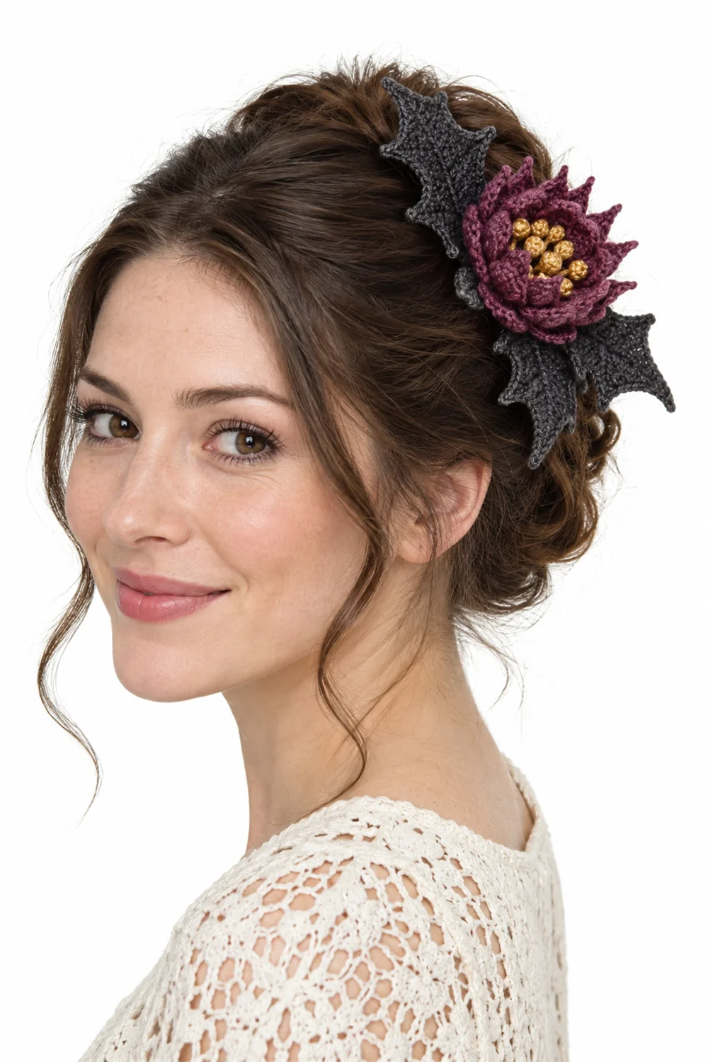 Dusty rose crochet hairpiece combining thistle flower and bat wing shapes
