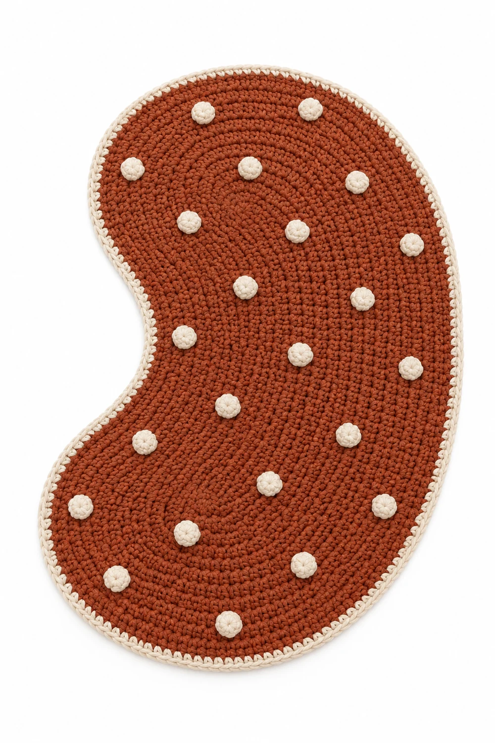 Rust orange crochet rug in an organic curved kidney shape